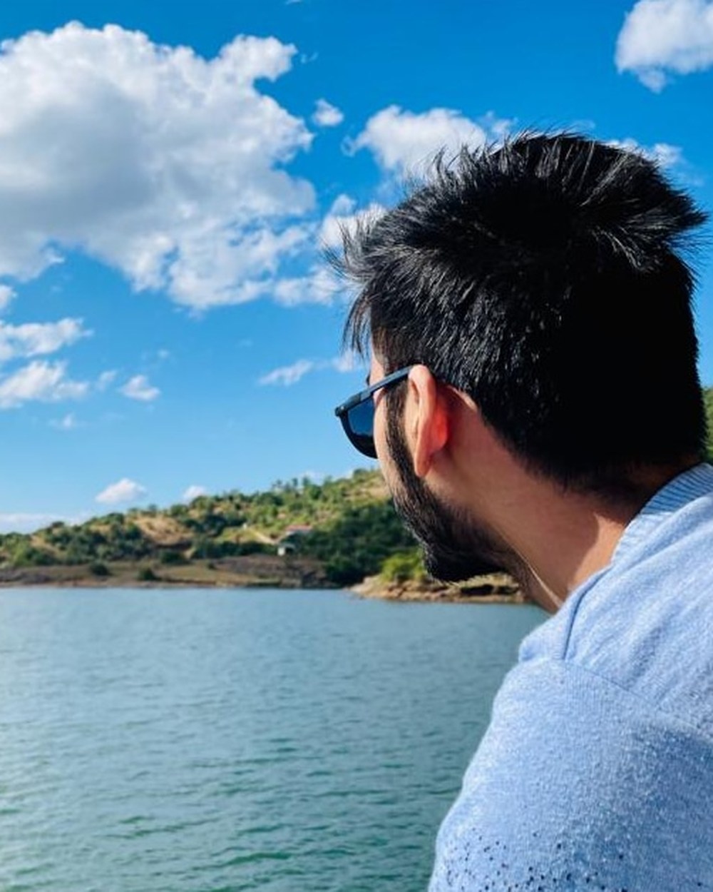 Shabbir looking out over a lake